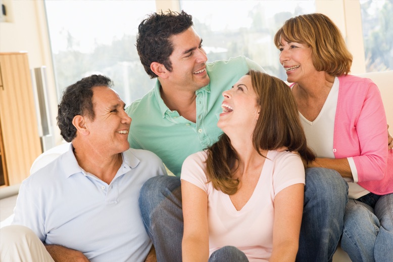 family sitting and laughing