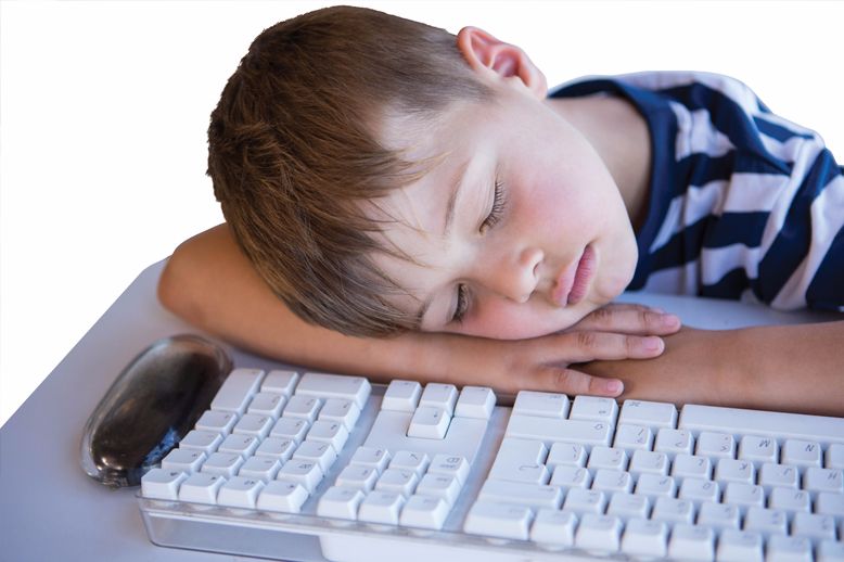 boy sleeping by keyboard