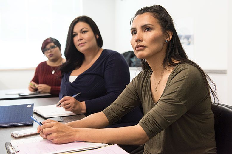 yukon u three female students in class