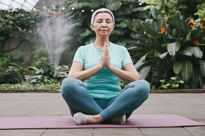 elderly woman meditating