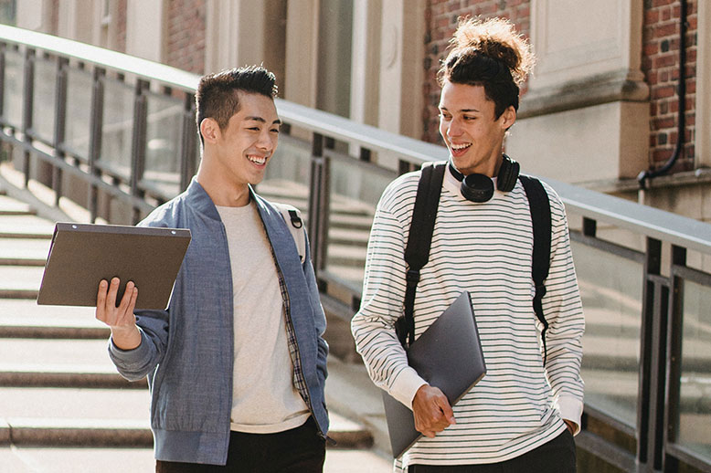 two teenage boys with backpacks