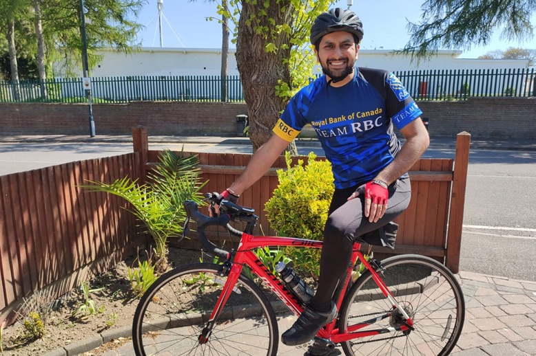 jay yadav in RBC jersey with bike