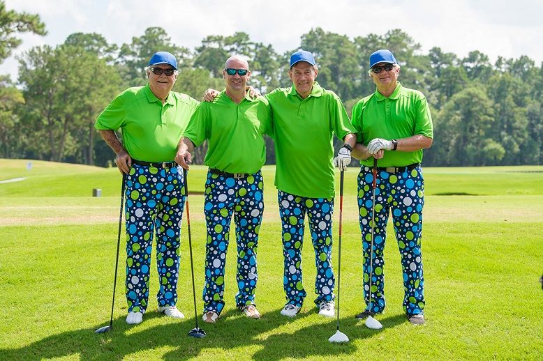 four golfers posing in same clothes