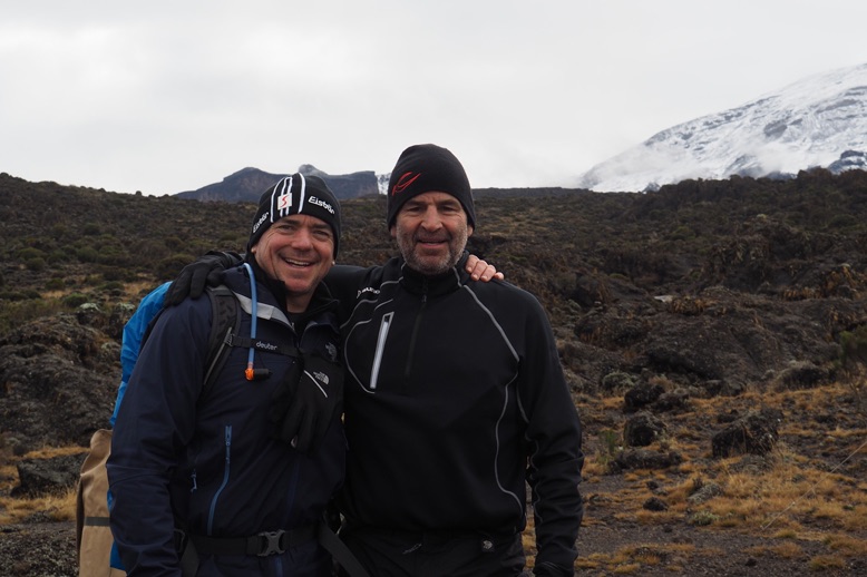 two climbers on kilimanjaro trek in page