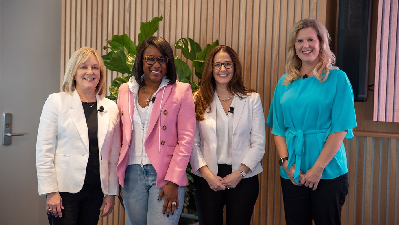 Photo of Suzanne Spellacy, Meka White Morris, Maureen Smith and Shareen Luze in discussion about the sports industry.