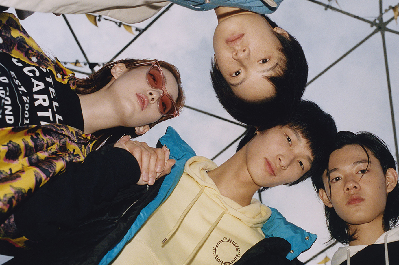 Photo of four gender fluid models wearing clothing by Stella McCartney