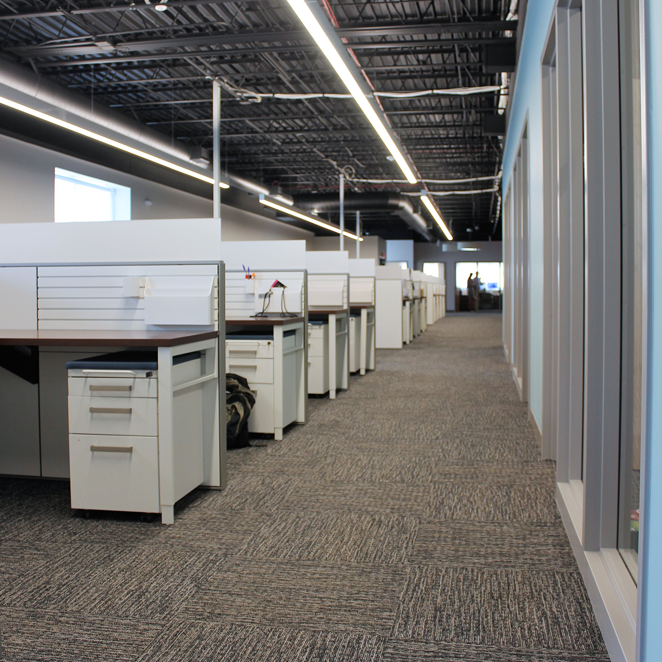 Photo of rows of donated workstations from RBC Wealth Management's former headquarters fill Simpson Housing Services' new Minneapolis office.