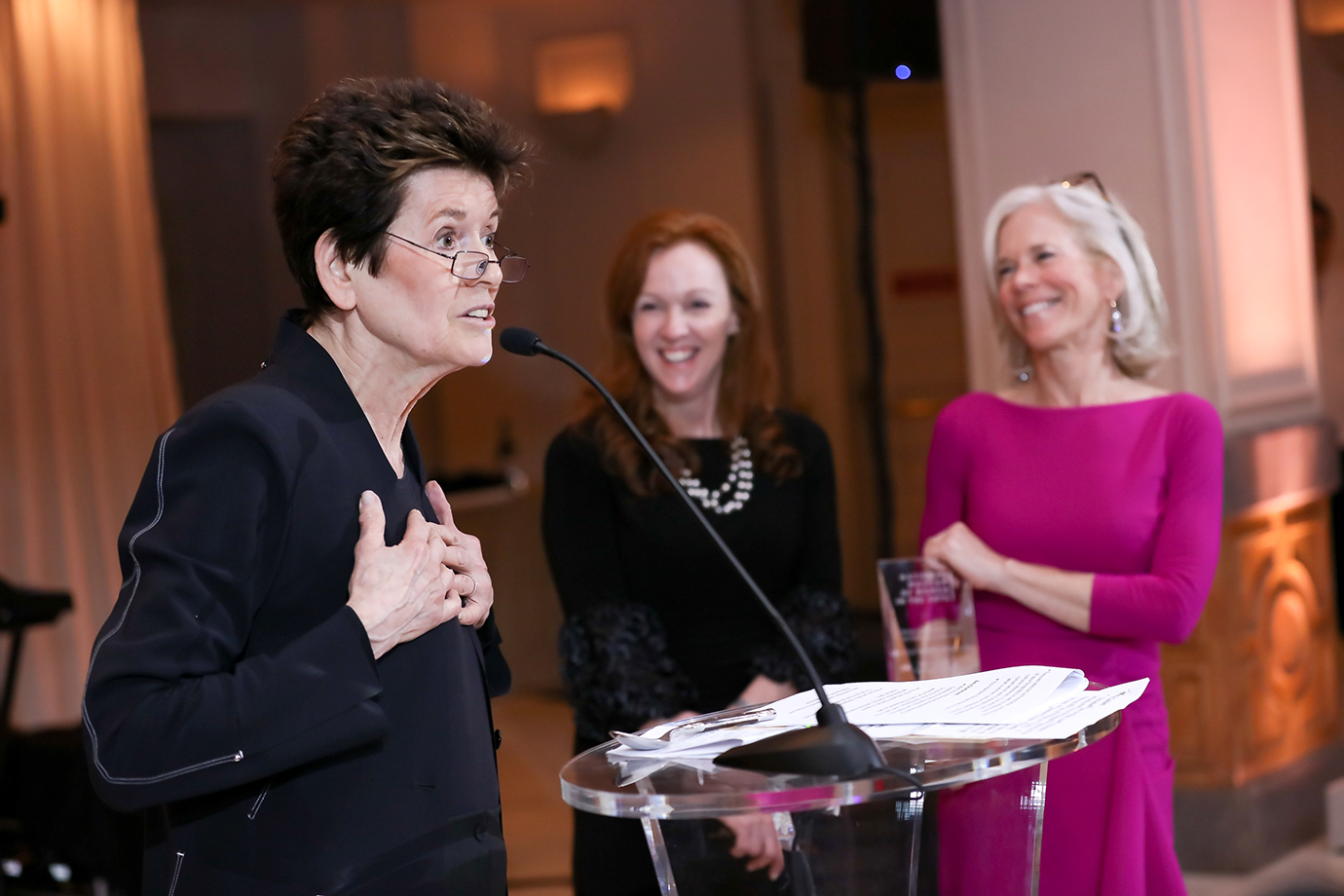 Photo of Amy Sturtevant helping present sculptor Ursula Von Rydingsvard with the NMWA Lifetime Achievement Award at the museum's 2019 Spring Gala.