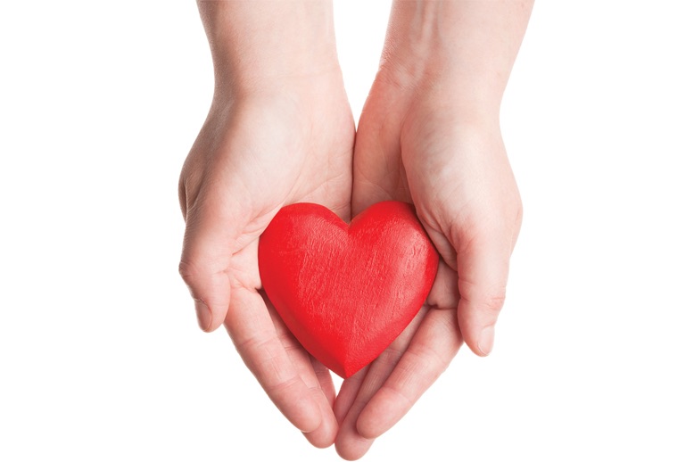 hands holding red heart