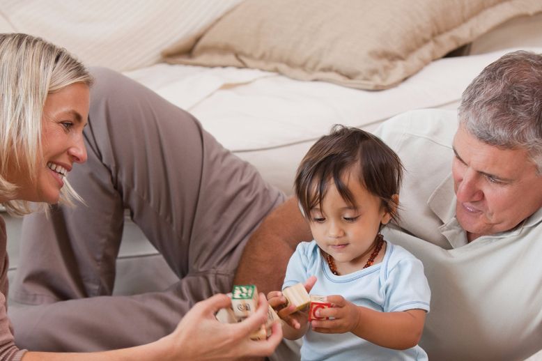 toddler playing with blocks with dad