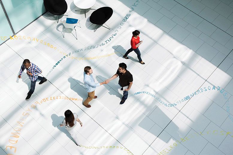 aerial shot of people shaking hands