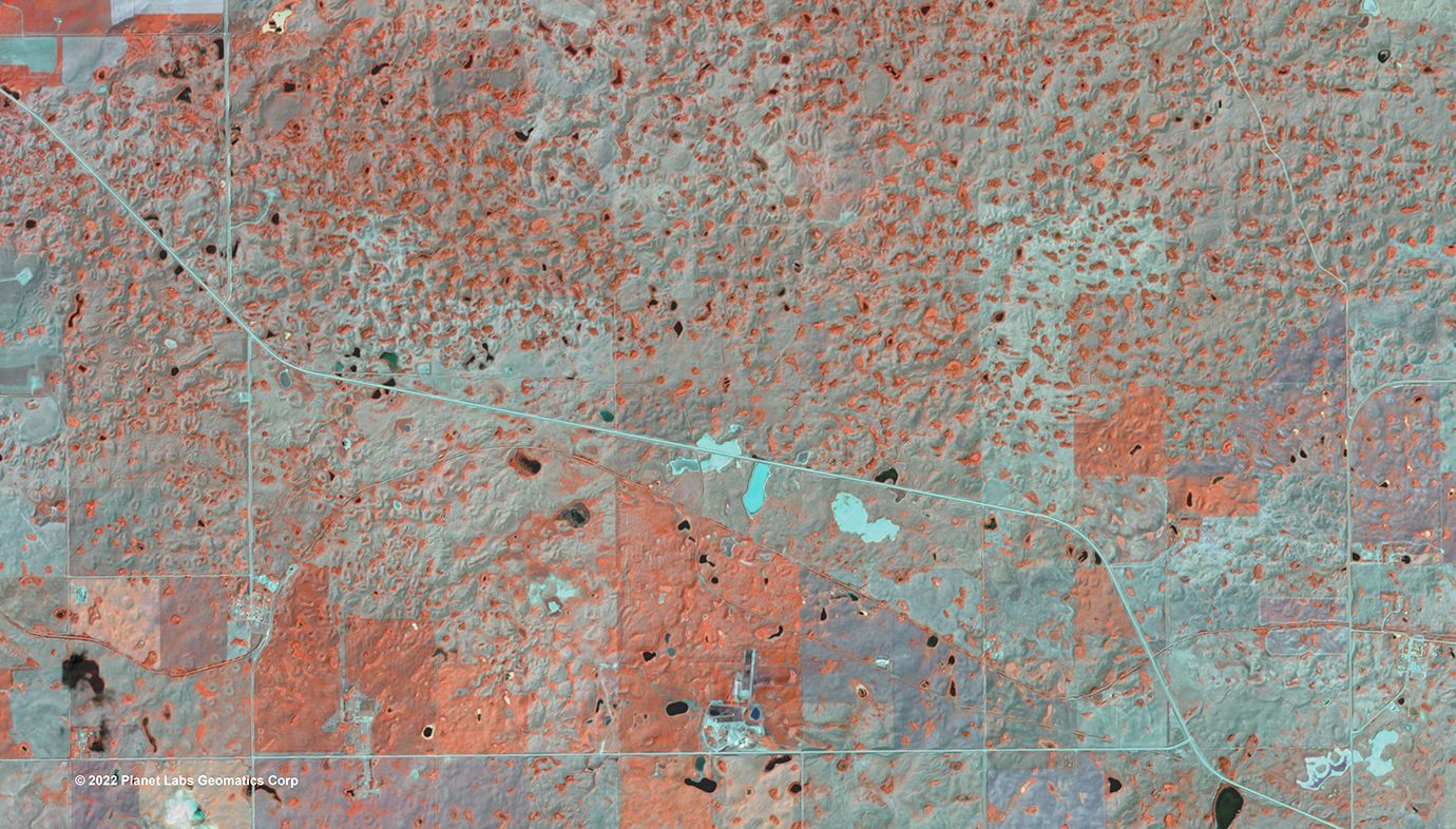 Summer satellite image captured in late July in pothole landscape in Eastern Plains of Alberta.